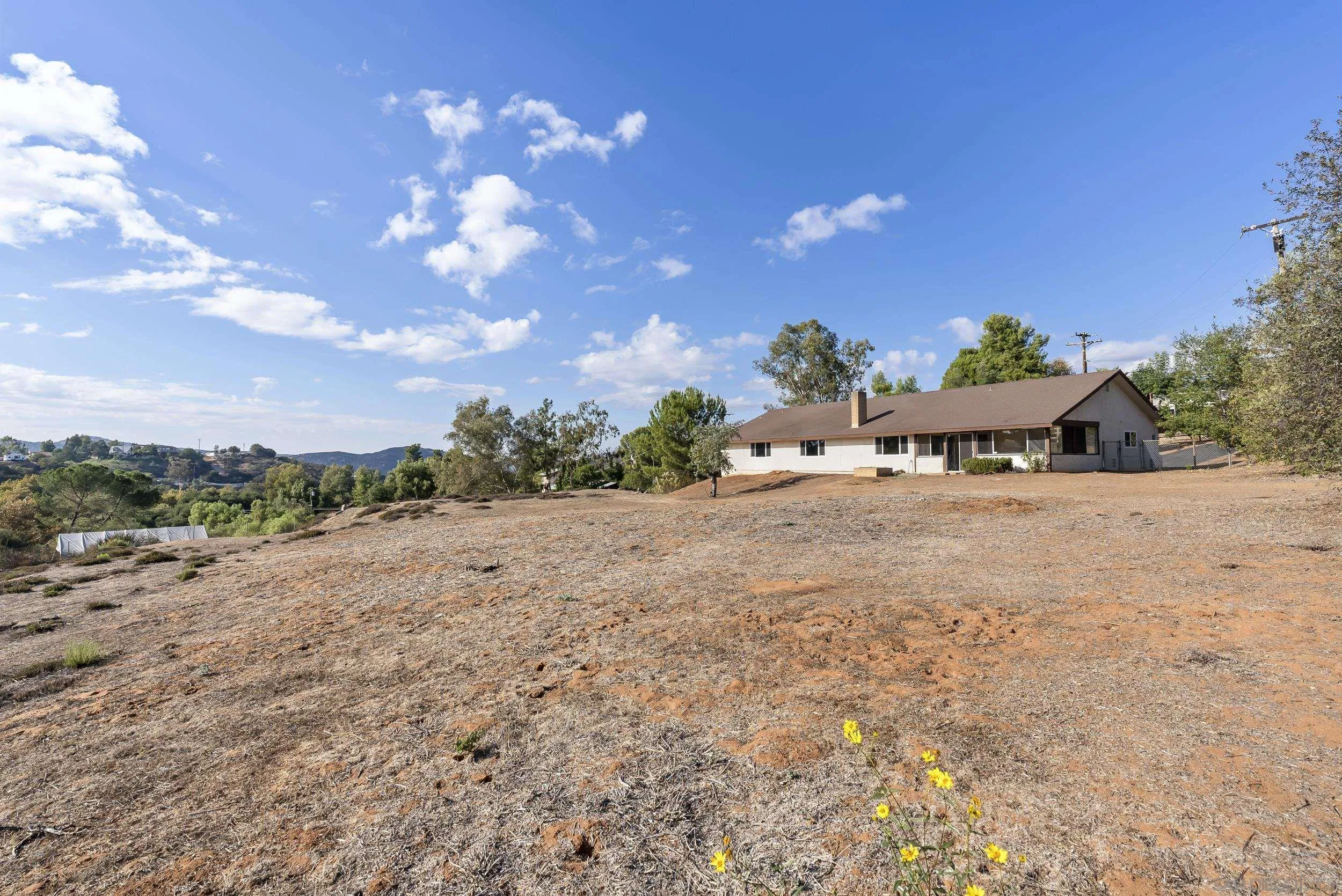 1429 Midway Drive Alpine, CA 91901 - Photo 38 of 42 a view of a dry yard with wooden fence