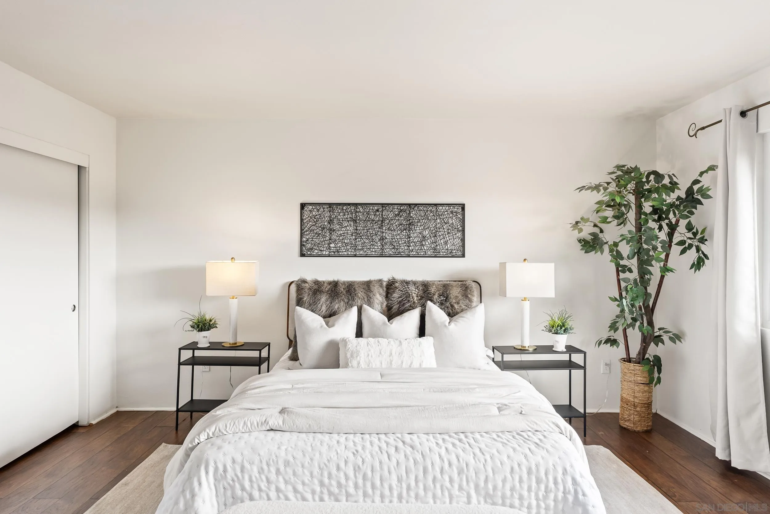 1429 Midway Drive Alpine, CA 91901 - Photo 8 of 42 a bedroom with a bed and a potted plant