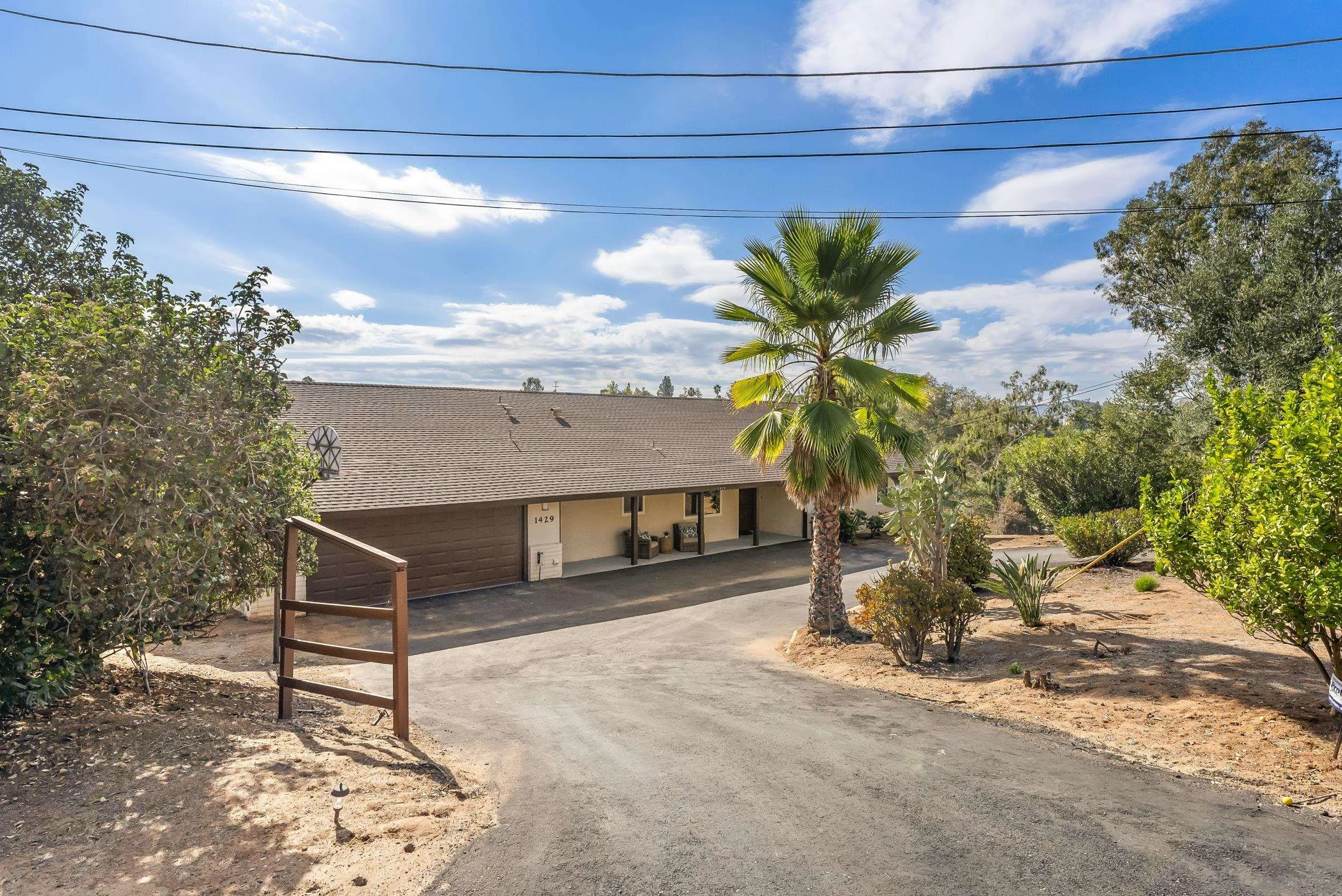 1429 Midway Drive Alpine, CA 91901 - Photo 9 of 42 a view of a house with a flower garden