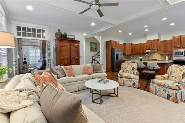 a kitchen with stainless steel appliances granite countertop a sink stove and cabinets