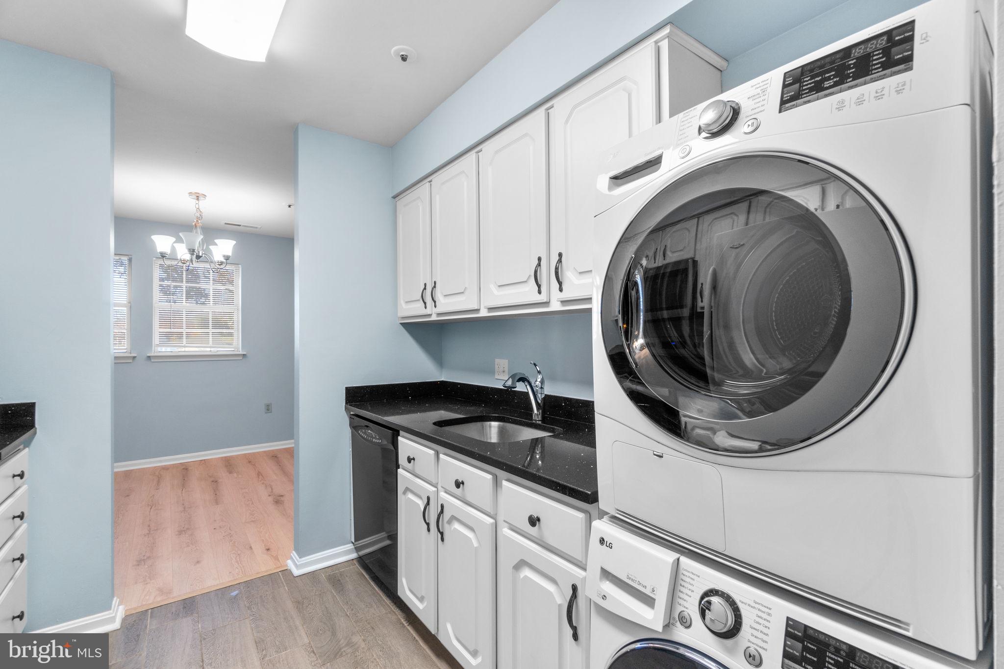 8378 Montgomery Run Road, Unit D Ellicott City, MD 21043 - Photo 16 of 30 a utility room with sink dryer and washer