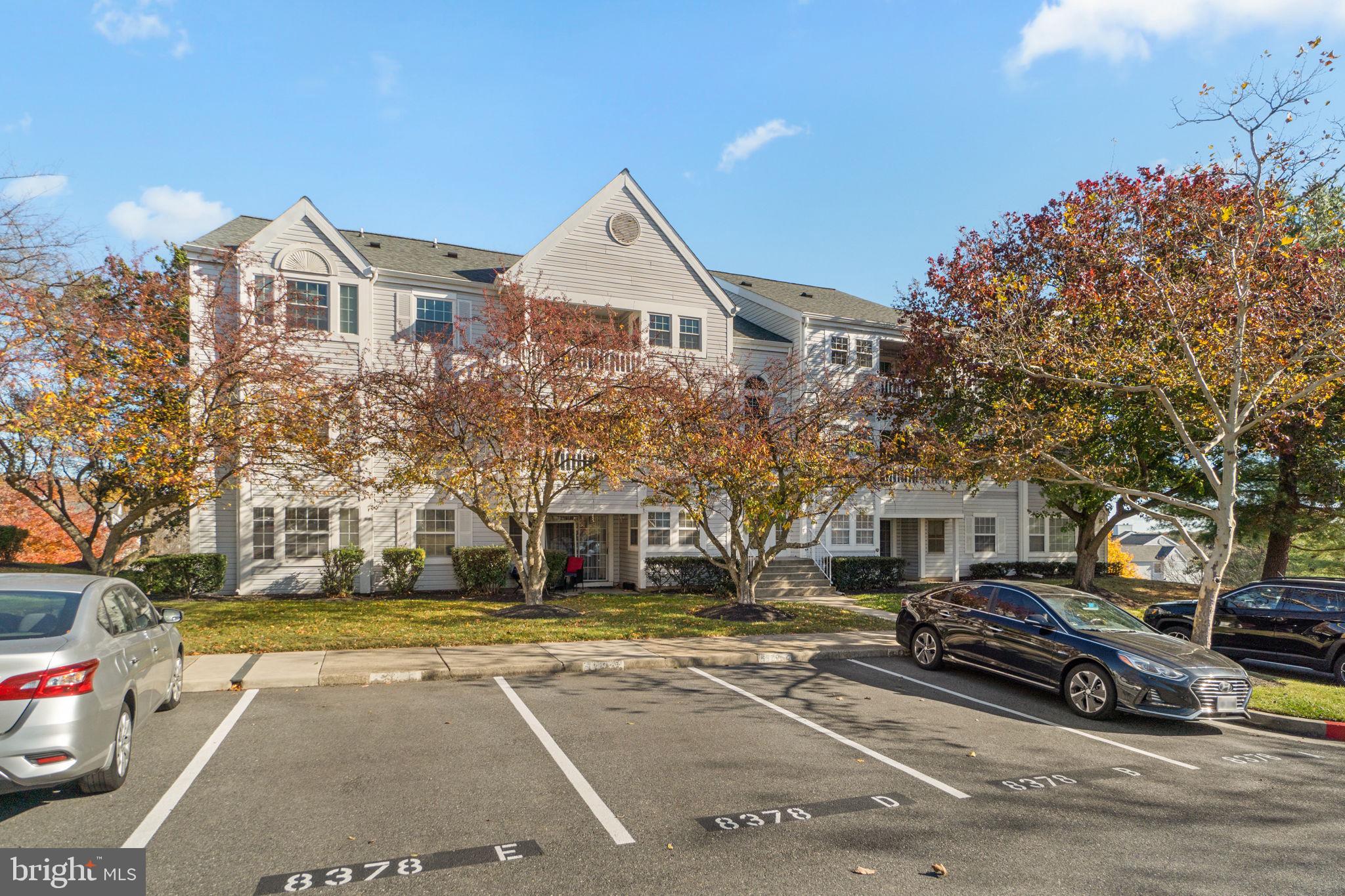 8378 Montgomery Run Road, Unit D Ellicott City, MD 21043 - Photo 2 of 30 a city street lined with buildings and cars
