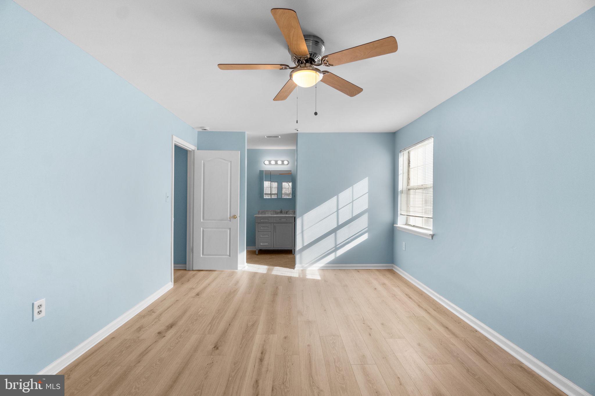 8378 Montgomery Run Road, Unit D Ellicott City, MD 21043 - Photo 26 of 30 a view of empty room with wooden floor