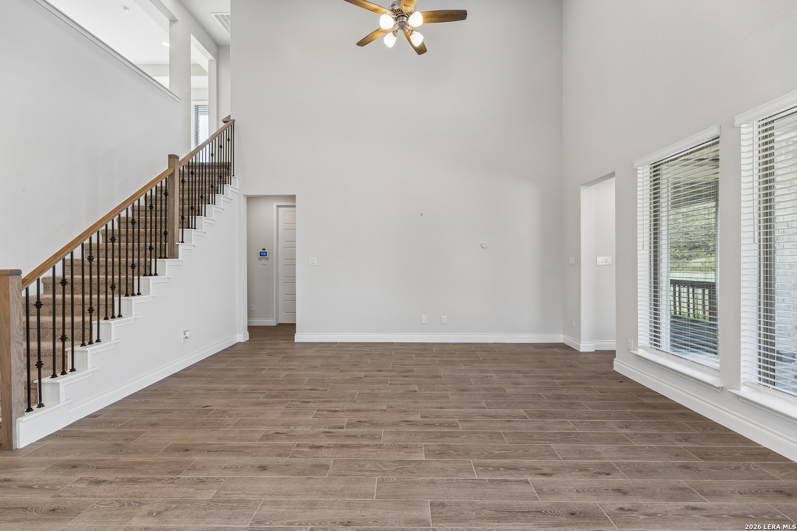 63 Ricadonna San Antonio, TX 78253 - Photo 14 of 43 a view of an empty room with wooden floor and a window