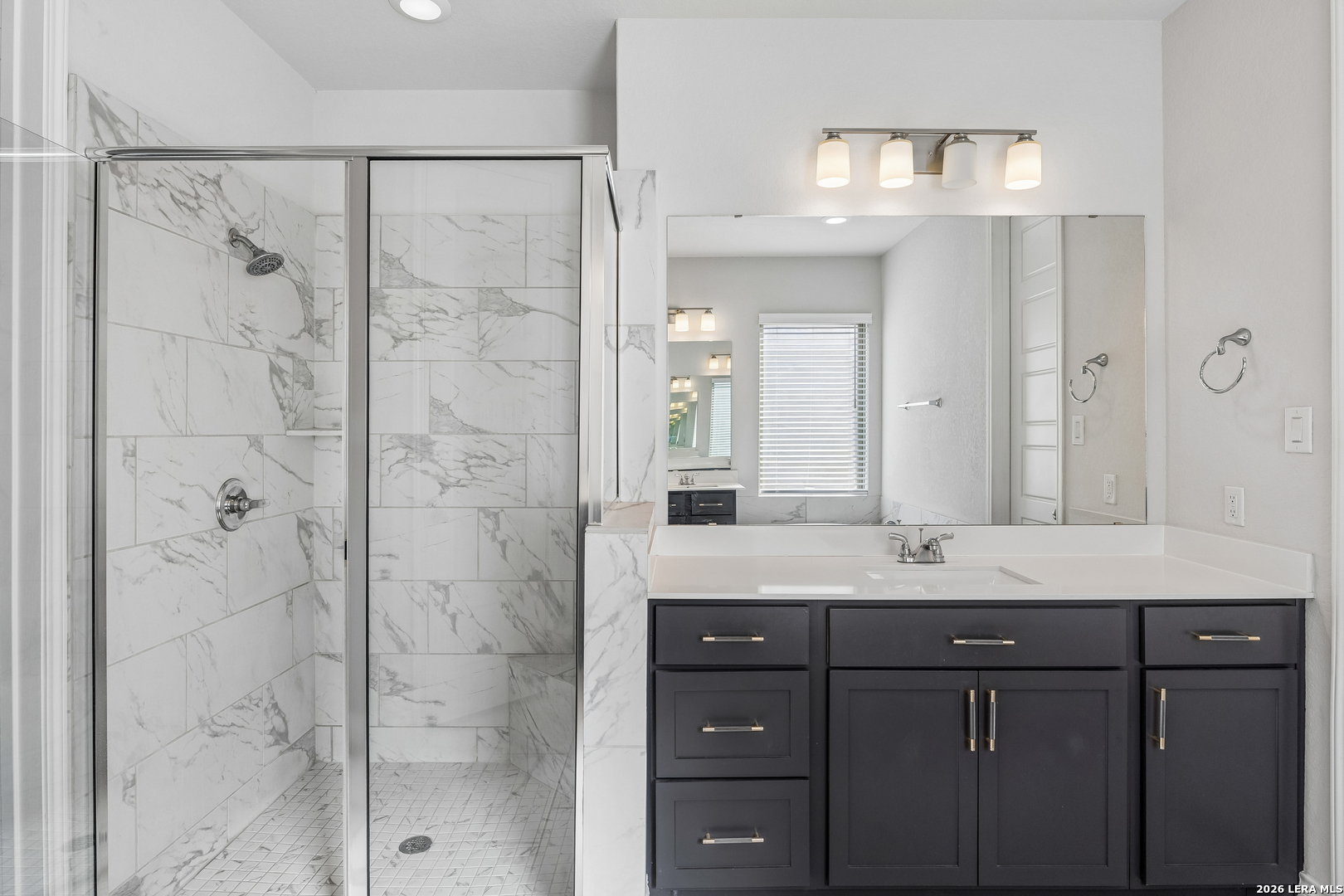 63 Ricadonna San Antonio, TX 78253 - Photo 20 of 43 a bathroom with a granite countertop sink mirror and shower