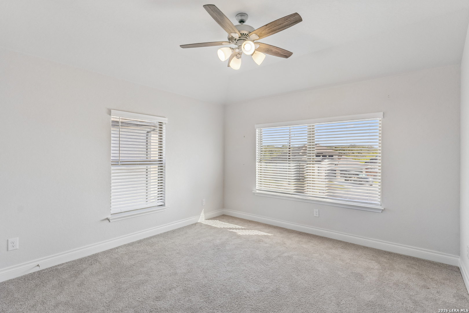 63 Ricadonna San Antonio, TX 78253 - Photo 26 of 43 an empty room with a window and a fan