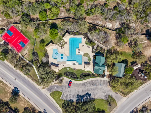 a view of a swimming pool with outdoor space and seating area