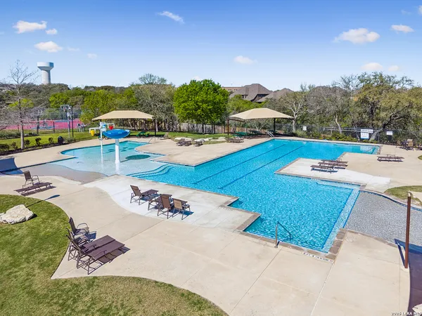 a view of a swimming pool with a patio