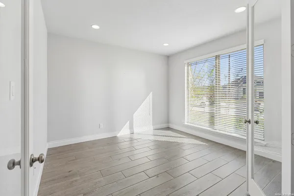 a view of an empty room with a window
