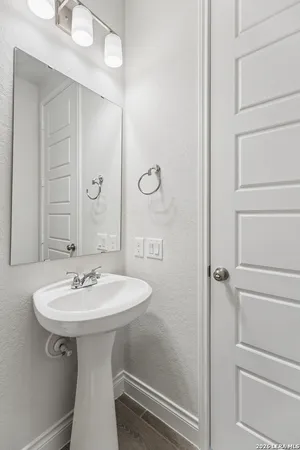 a bathroom with a sink and mirror