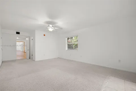 a spacious bathroom with a shower sink and mirror