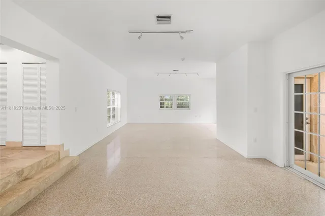 an empty room with windows