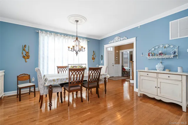 a dining room with furniture window wooden floor