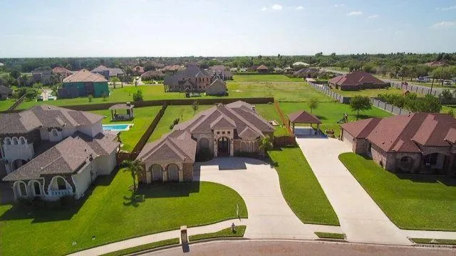 an aerial view of a house with outdoor space