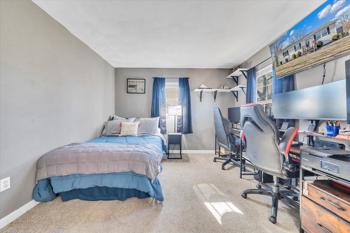 2624 Radford Road Northeast Roanoke, VA 24012 - Photo 13 of 55 a bedroom with a bed gym equipment and mirror