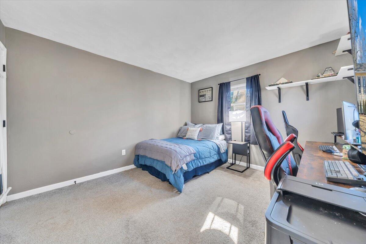 2624 Radford Road Northeast Roanoke, VA 24012 - Photo 14 of 55 a bedroom with a bed and gym equipment