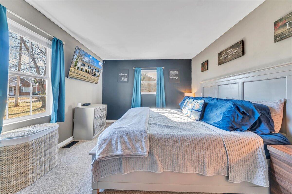 2624 Radford Road Northeast Roanoke, VA 24012 - Photo 17 of 55 a bed room with a bed and a window