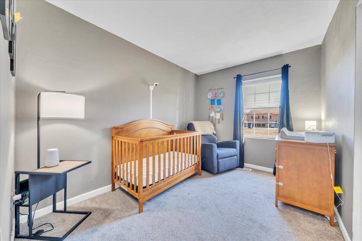 2624 Radford Road Northeast Roanoke, VA 24012 - Photo 19 of 55 a bedroom with furniture and a window
