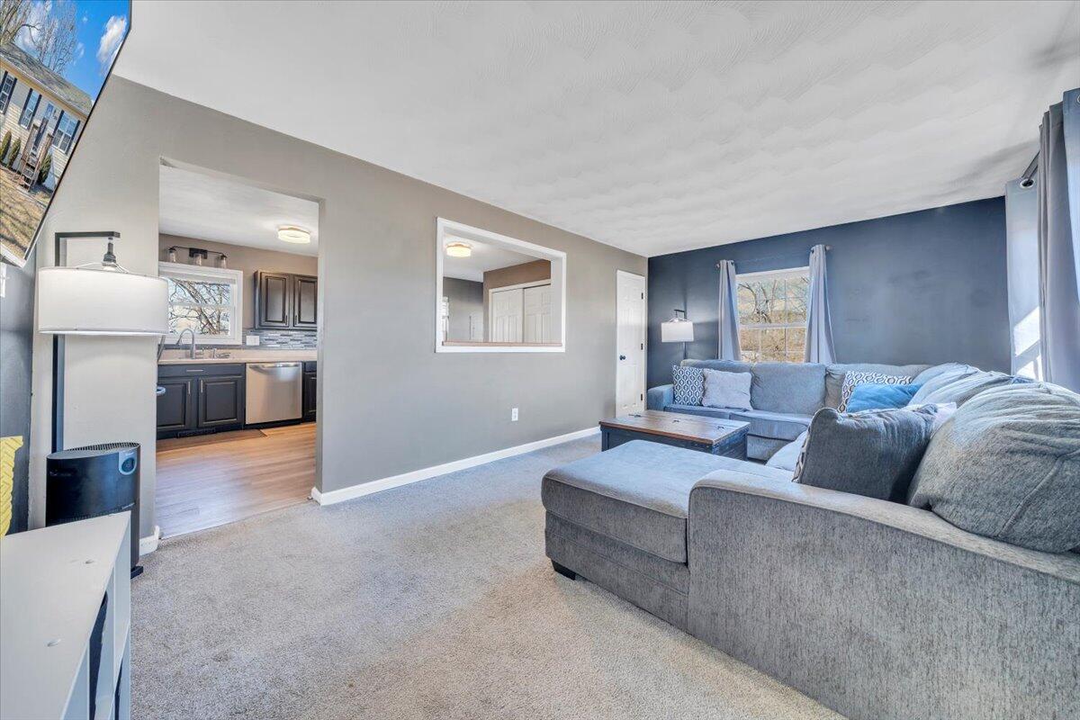 2624 Radford Road Northeast Roanoke, VA 24012 - Photo 2 of 55 a living room with furniture and a couch