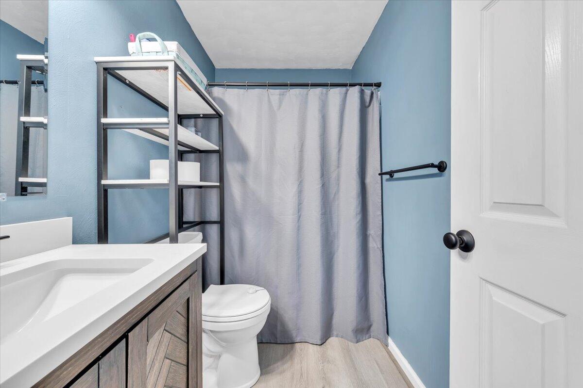 2624 Radford Road Northeast Roanoke, VA 24012 - Photo 22 of 55 a bathroom with a sink a toilet and shower