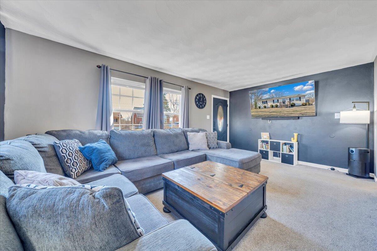 2624 Radford Road Northeast Roanoke, VA 24012 - Photo 5 of 55 a living room with furniture a rug and a window