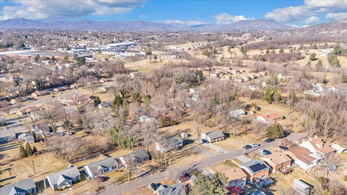2624 Radford Road Northeast Roanoke, VA 24012 - Photo 54 of 55 an aerial view of house with yard and mountain view in back