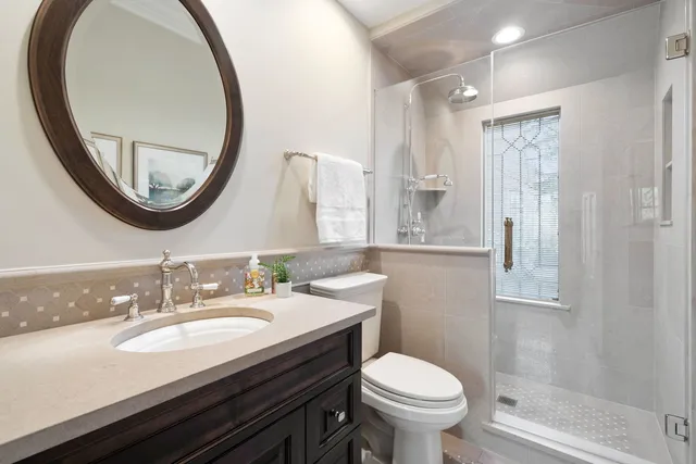 a spacious bedroom with a balcony a bed and a fireplace