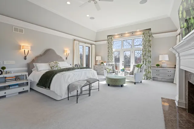 a spacious bathroom with a sink a large mirror and a shower