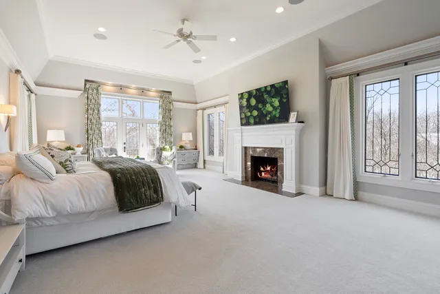 a large bedroom with a bed and a cabinets