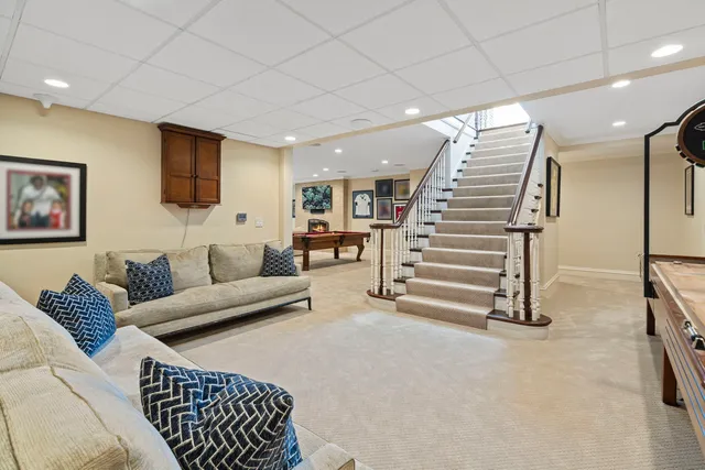 a view of a patio with a dining table and chairs with wooden floor