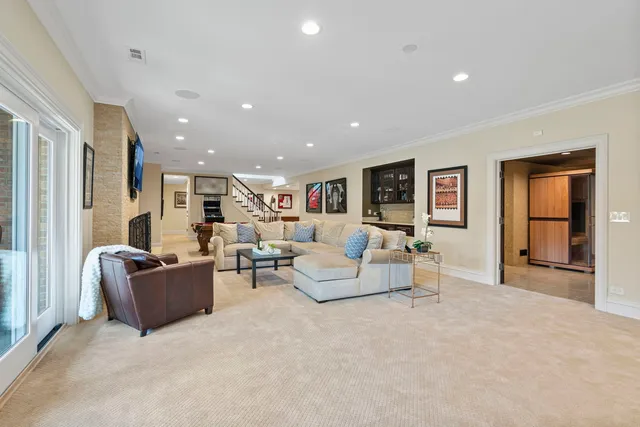a view of a patio with table and chairs potted plants with wooden floor and fence