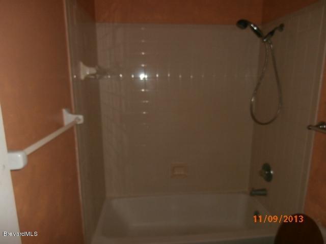 265 Benchor Road Northwest Palm Bay, FL 32907 - Photo 13 of 14 a bathroom with a shower
