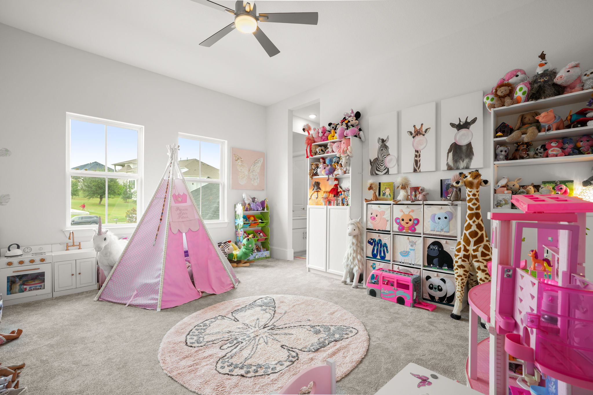104 Lodestone Cove Austin, TX 78738 - Photo 32 of 40 A playful children's bedroom features plush carpet, two large windows, and a ceiling fan for comfort.