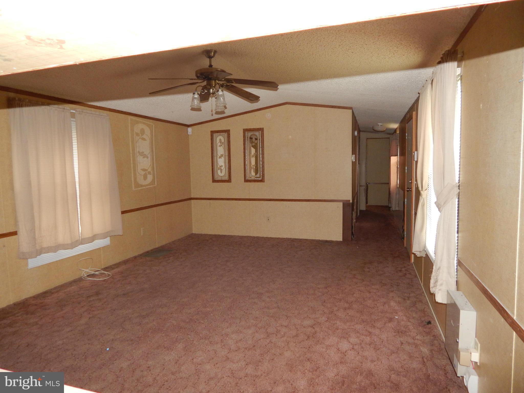 189 Washington Street Inwood, WV 25428 - Photo 13 of 30 a view of a house with a ceiling fan