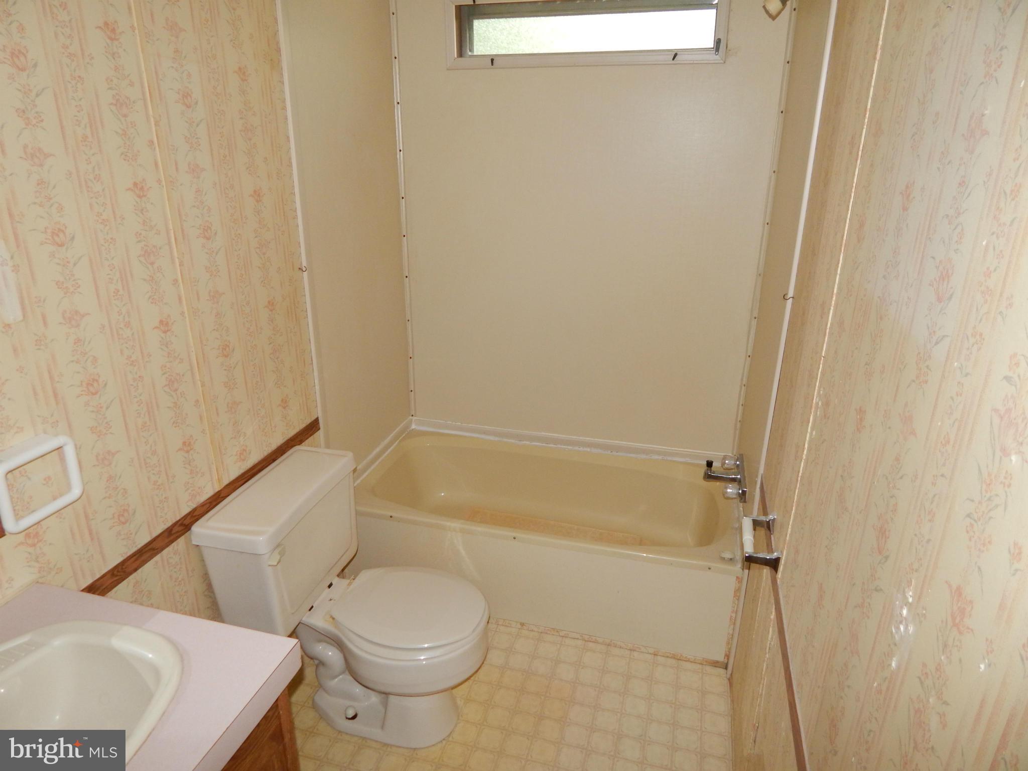 189 Washington Street Inwood, WV 25428 - Photo 15 of 30 a bathroom with a toilet and a shower