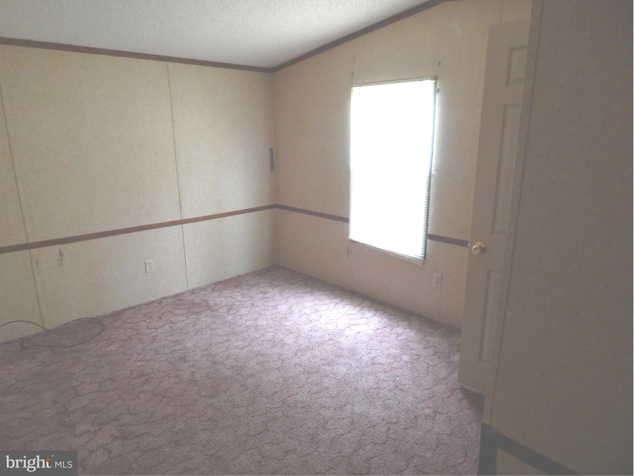 189 Washington Street Inwood, WV 25428 - Photo 16 of 30 a view of an empty room with a window