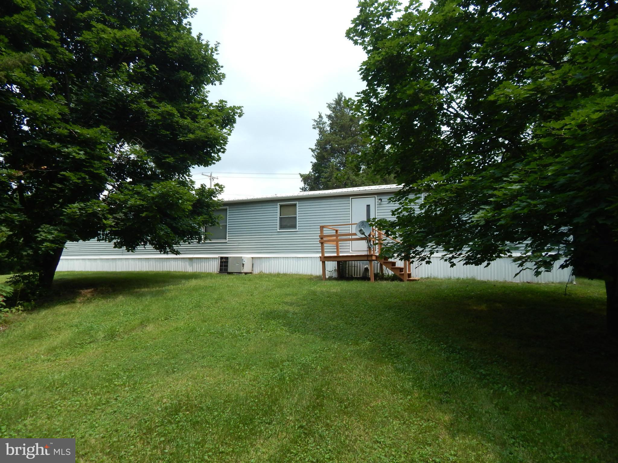 189 Washington Street Inwood, WV 25428 - Photo 22 of 30 a front view of a house with garden