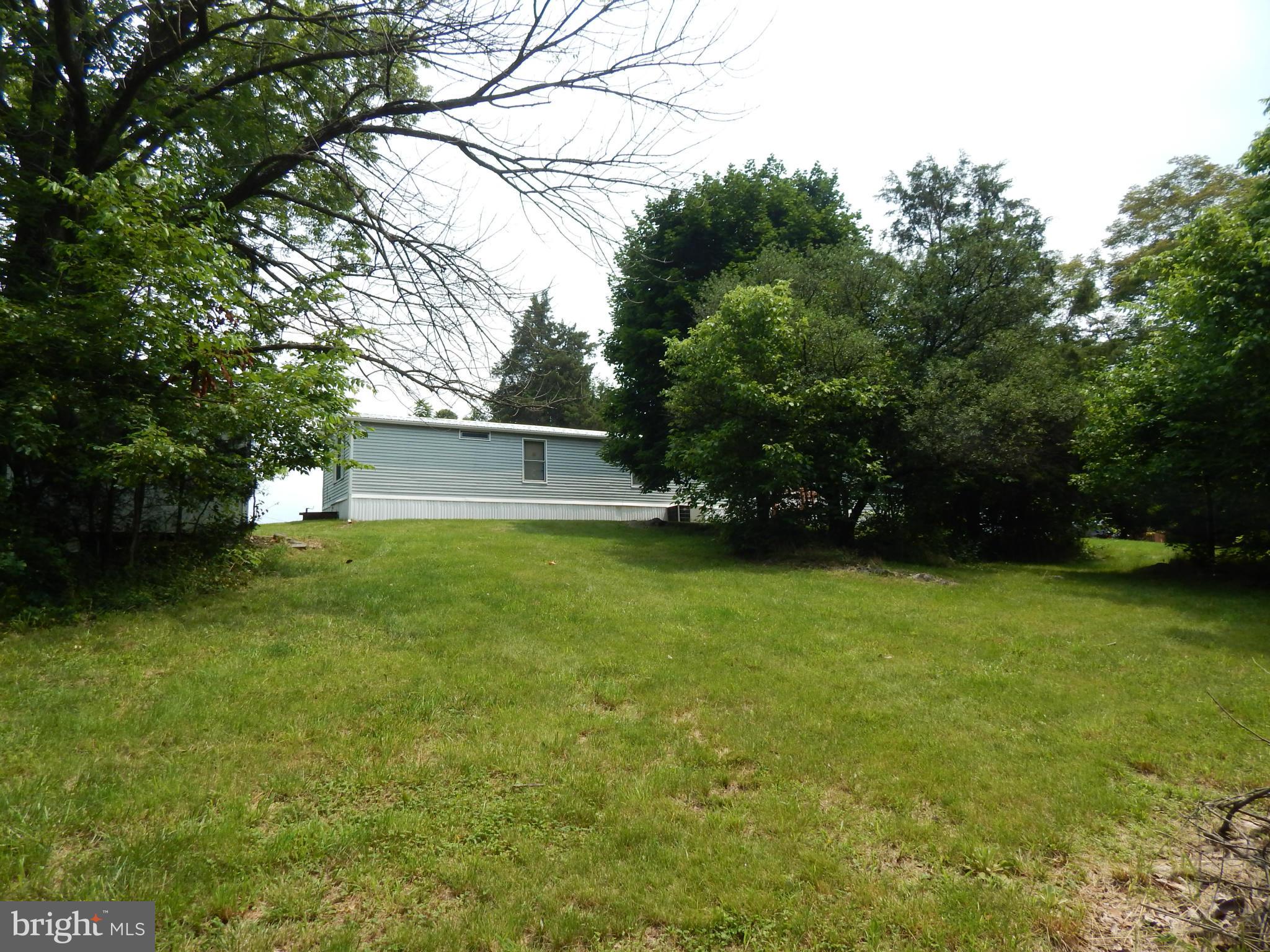 189 Washington Street Inwood, WV 25428 - Photo 29 of 30 a view of a tree in front of a house