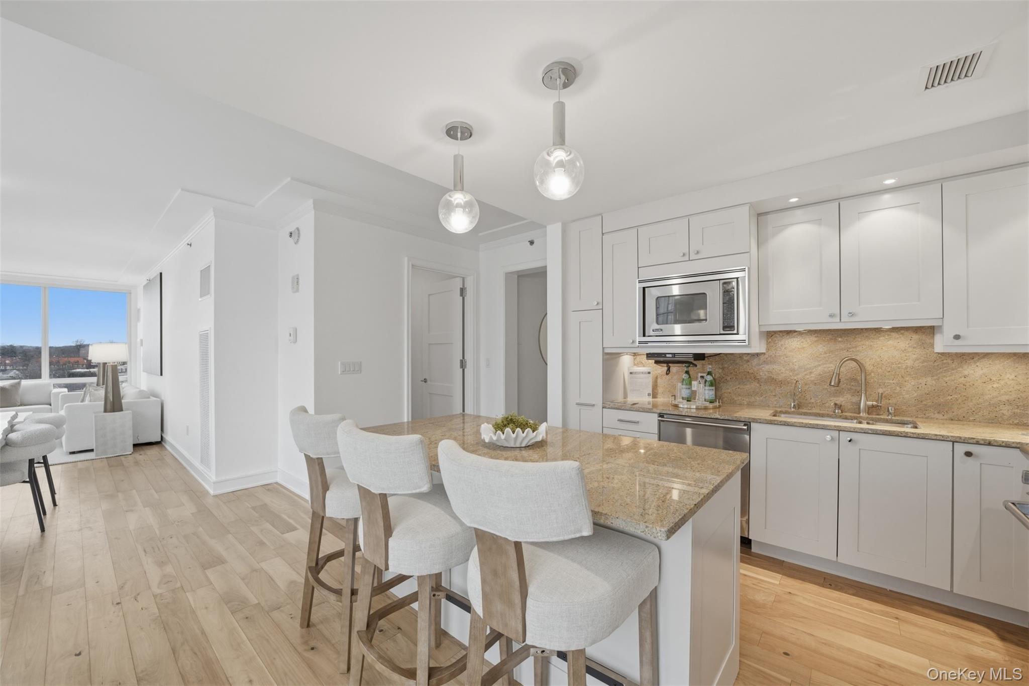 5 Renaissance Square, Unit 16D White Plains, NY 10601 - Photo 12 of 36 a view of a kitchen and dining room