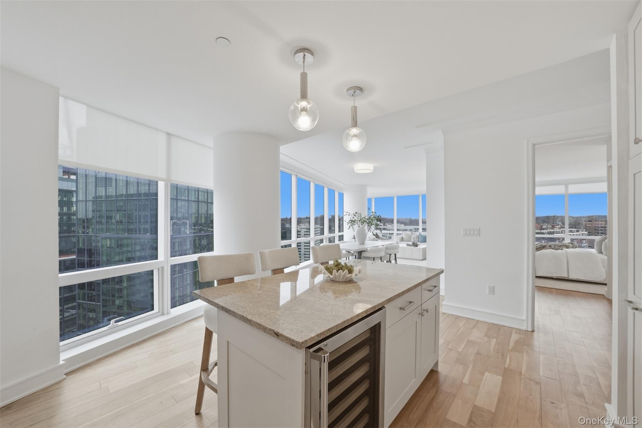 5 Renaissance Square, Unit 16D White Plains, NY 10601 - Photo 13 of 36 a view of kitchen island a sink and a refrigerator