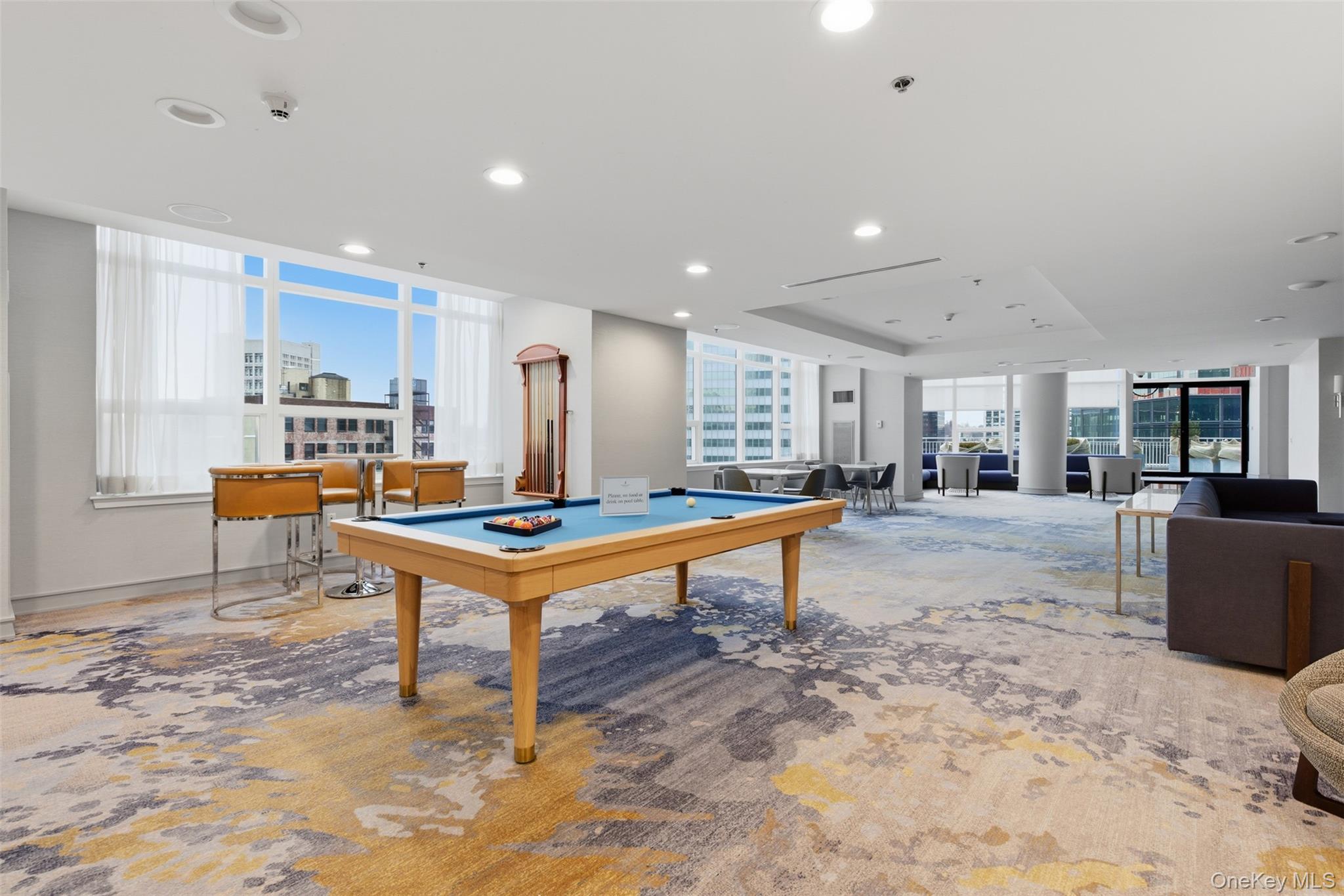 5 Renaissance Square, Unit 16D White Plains, NY 10601 - Photo 25 of 29 Recreation room featuring a pool table, lounge area, kitchen and full bath