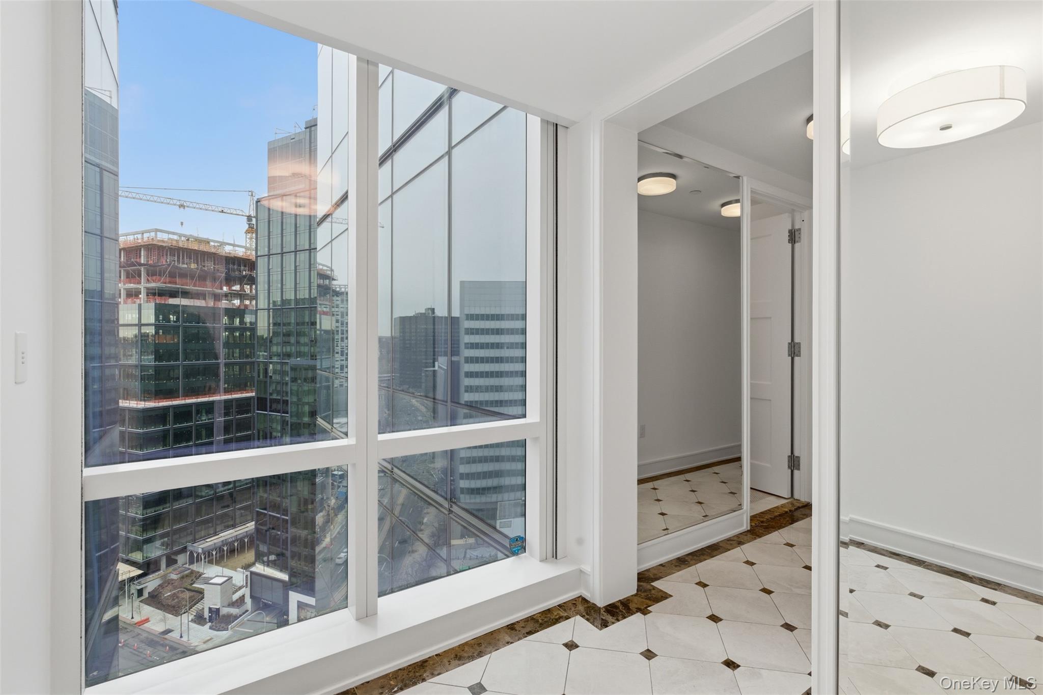 5 Renaissance Square, Unit 16D White Plains, NY 10601 - Photo 26 of 36 a view of a glass door and a window