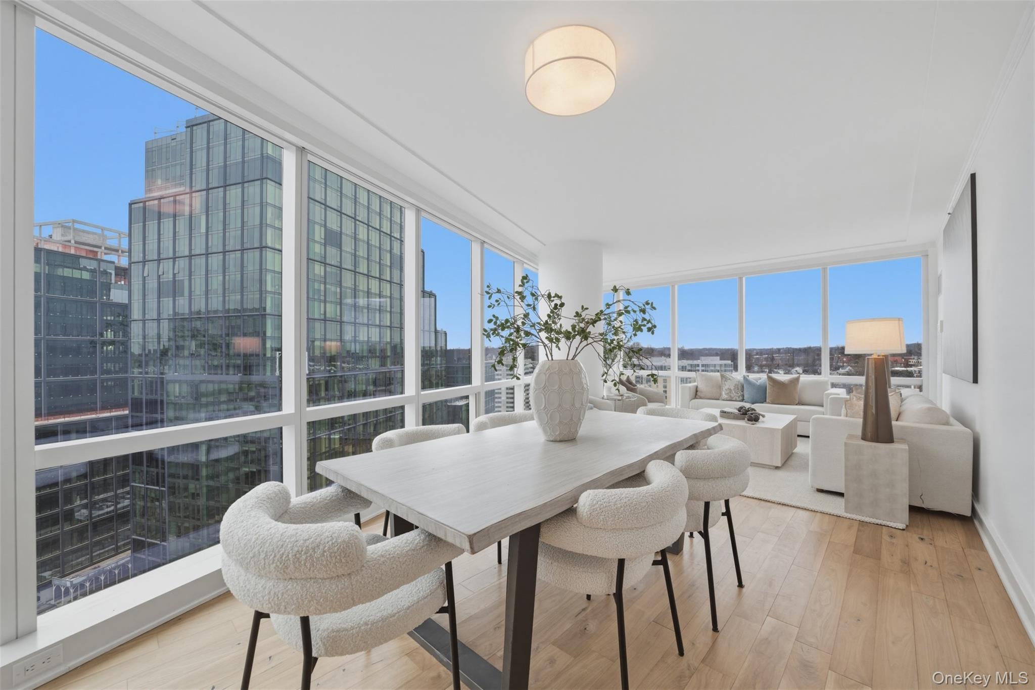 5 Renaissance Square, Unit 16D White Plains, NY 10601 - Photo 9 of 36 a view of a dining room with furniture window and outside view