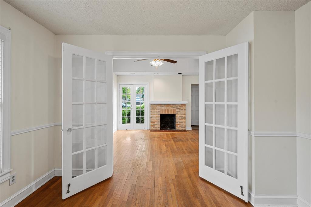 2601 Proctor Avenue Waco, TX 76708 - Photo 8 of 28 a view of an empty room with wooden floor and a window