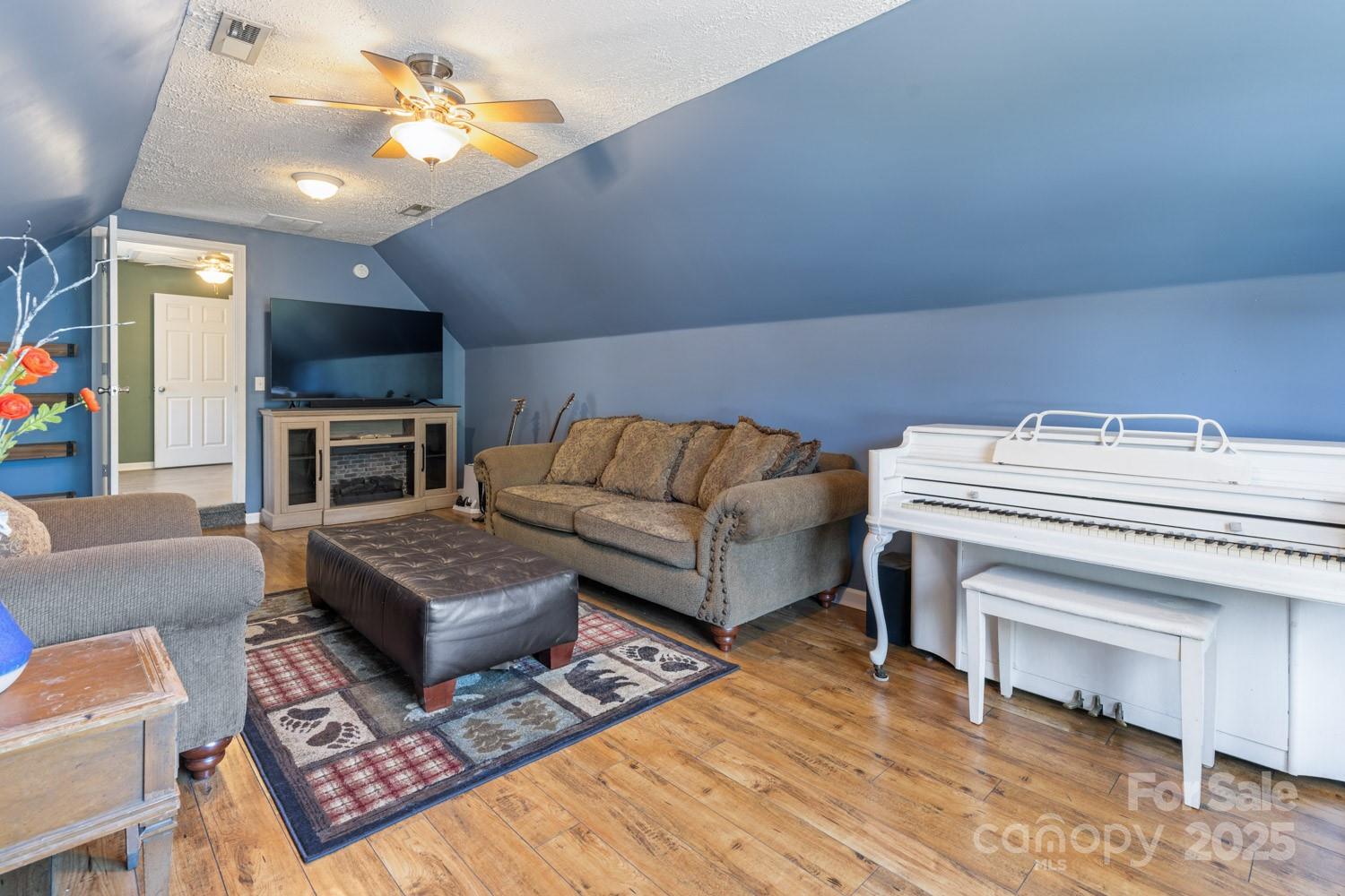 122 Ramsey Road Asheville, NC 28806 - Photo 15 of 19 a living room with furniture and a fireplace