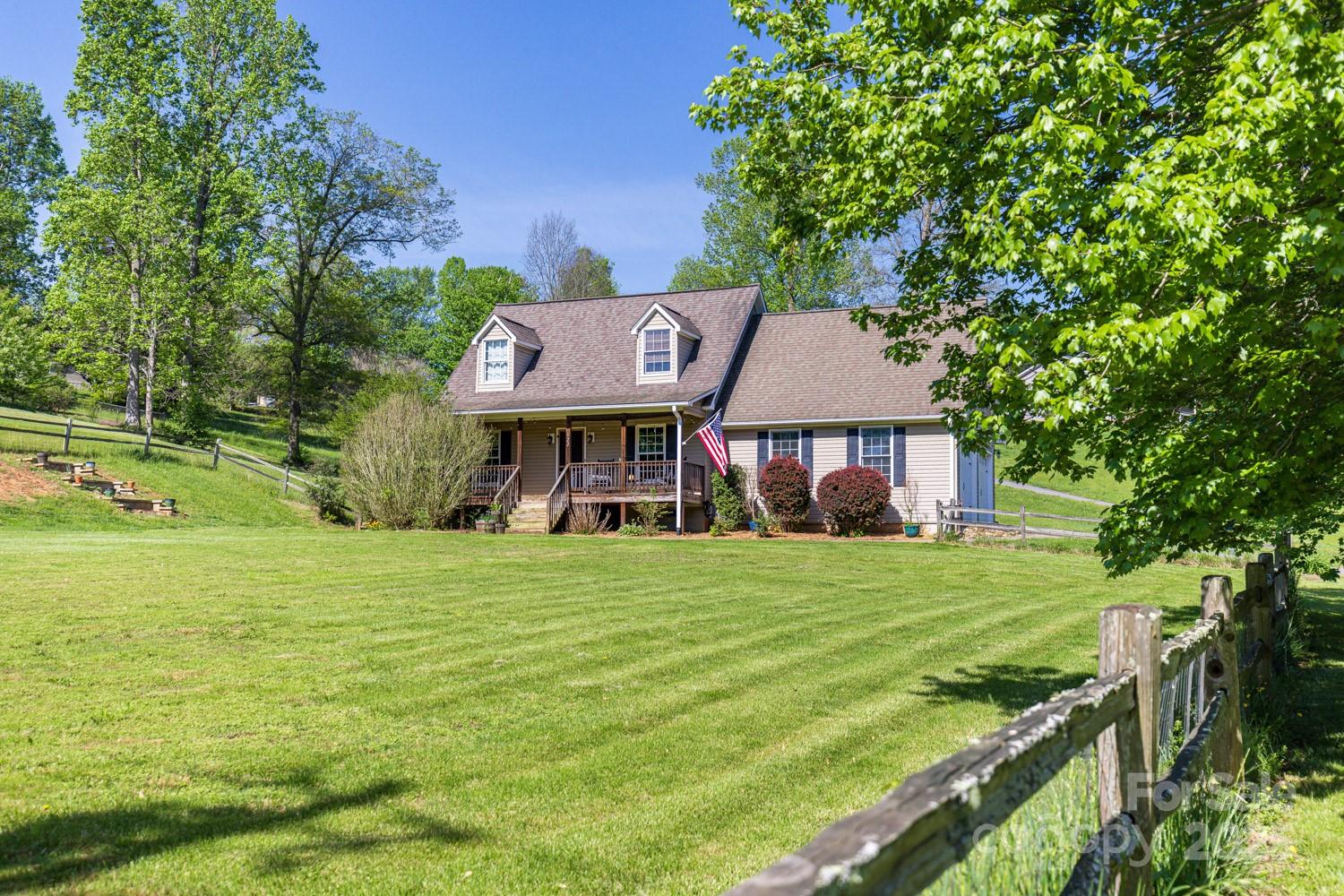 122 Ramsey Road Asheville, NC 28806 - Photo 2 of 19 a front view of a house with a garden