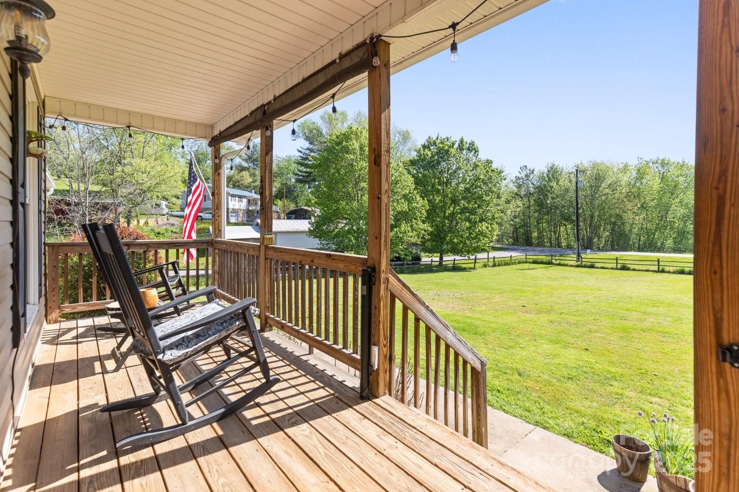 122 Ramsey Road Asheville, NC 28806 - Photo 4 of 19 a view of a chairs and deck in the balcony