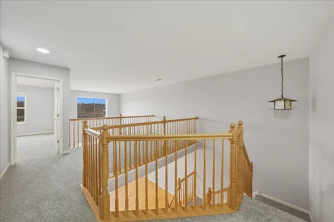 a view of hallway with stairs
