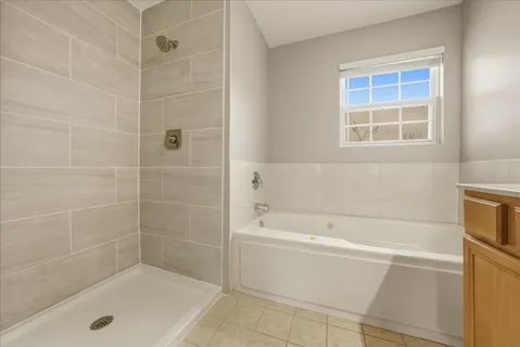 a white bath tub sitting next to a window