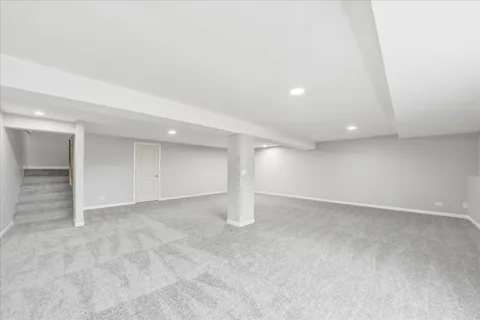 an empty room with windows and pillars in it